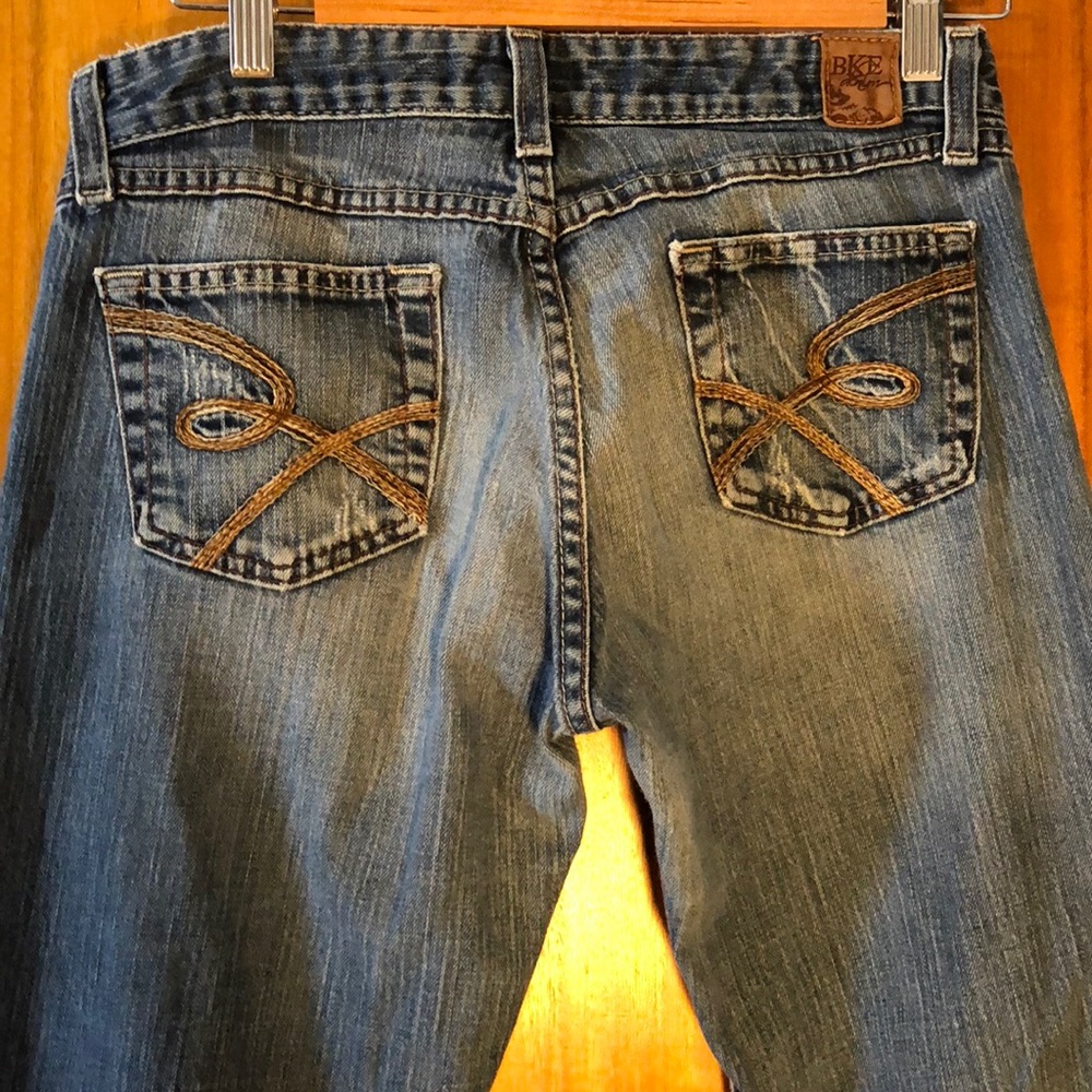 BKE Women's Flare Jeans in Medium Blue with Brown Stitching